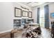 Stylish home office featuring unique metal desk, airplane decor and a cowhide rug at 2242 Soaring Eagle Pl, Lake Mary, FL 32746