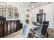 Well-appointed home office with aviation-themed decor, wooden floors, and plenty of natural light at 2242 Soaring Eagle Pl, Lake Mary, FL 32746
