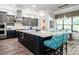 Modern kitchen boasting gray cabinets, a large island and stainless steel appliances at 2242 Soaring Eagle Pl, Lake Mary, FL 32746