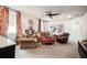 Comfortable living room with cozy seating, colorful curtains, and decorative accents at 2242 Soaring Eagle Pl, Lake Mary, FL 32746