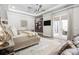 This main bedroom has a ceiling fan, wood floors, and french doors that lead outside at 2242 Soaring Eagle Pl, Lake Mary, FL 32746