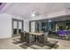 Covered patio with a dining table, chairs, ceiling fan, and sliding glass doors to the home's interior at 2242 Soaring Eagle Pl, Lake Mary, FL 32746