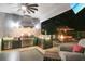 An outdoor kitchen featuring stainless steel appliances, a grill, bar seating, and a fire pit at 2242 Soaring Eagle Pl, Lake Mary, FL 32746