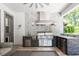 Outdoor kitchen with stainless steel grill, hood, and sink at 2242 Soaring Eagle Pl, Lake Mary, FL 32746