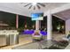 Outdoor living space with a TV, seating area, outdoor kitchen, and a view of the pool at 2242 Soaring Eagle Pl, Lake Mary, FL 32746