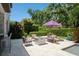 Back patio with outdoor furniture, fire pit, and partial view of swimming pool at 2242 Soaring Eagle Pl, Lake Mary, FL 32746