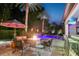 Captivating backyard retreat with a pool, fire pit, comfortable seating, and an outdoor bar at 2242 Soaring Eagle Pl, Lake Mary, FL 32746