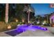 Tranquil backyard pool with palm trees, accent lighting, and well-manicured landscaping at 2242 Soaring Eagle Pl, Lake Mary, FL 32746