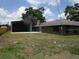 Home featuring a large storage shed and spacious backyard at 5190 Starling Dr, Mulberry, FL 33860