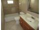 Bathroom featuring a tub and shower, vanity, and tiled floors at 5190 Starling Dr, Mulberry, FL 33860