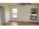 Bedroom featuring multiple windows and hardwood floors at 5190 Starling Dr, Mulberry, FL 33860