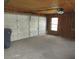 Spacious garage with a white door and window at 5190 Starling Dr, Mulberry, FL 33860