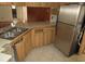 Kitchen with stainless steel refrigerator and wrap around countertops at 5190 Starling Dr, Mulberry, FL 33860