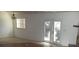 Living room with sliding glass doors and natural light at 5190 Starling Dr, Mulberry, FL 33860