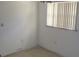 Bright room featuring a window with blinds and neutral-toned walls at 5190 Starling Dr, Mulberry, FL 33860
