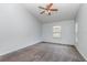 Neutral bedroom featuring carpet, one window with blinds and a ceiling fan offering a serene retreat at 216 Kingshill Se Ct, Winter Haven, FL 33884