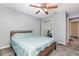 Bedroom featuring a bed, mirrored sliding-door closet and ceiling fan at 216 Kingshill Se Ct, Winter Haven, FL 33884
