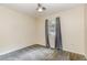 Cozy bedroom with neutral carpet, one window with curtains and ceiling fan, creating a peaceful ambiance at 216 Kingshill Se Ct, Winter Haven, FL 33884