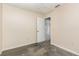 Bedroom with neutral carpet and adjoining space, offering flexibility for office or creative pursuits at 216 Kingshill Se Ct, Winter Haven, FL 33884