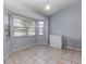 Bright dining area featuring tiled flooring, an expansive window, and neutral paint at 216 Kingshill Se Ct, Winter Haven, FL 33884