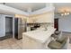 Bright kitchen with barstool seating, stainless steel appliances, and tile flooring at 216 Kingshill Se Ct, Winter Haven, FL 33884