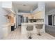 Open kitchen with a breakfast bar, stainless steel appliances, and tile flooring at 216 Kingshill Se Ct, Winter Haven, FL 33884