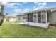 Enclosed back porch or sun room with bikes visible, blending indoor comfort with outdoor views at 216 Kingshill Se Ct, Winter Haven, FL 33884