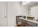 Bathroom with granite vanity top and stainless steel fixtures at 3067 Princewood Dr, Minneola, FL 34715