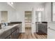 Bathroom boasts double vanities, dark cabinets, and views into the bedroom at 3067 Princewood Dr, Minneola, FL 34715