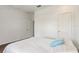 Bedroom with a wood-look tile floor and a single throw pillow on the bed at 3067 Princewood Dr, Minneola, FL 34715