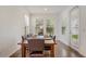Dining room with a large table, seating for ten, and bright natural light from the backyard at 3067 Princewood Dr, Minneola, FL 34715