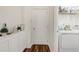 Well-lit laundry room with built-in cabinets and modern washer and dryer at 3067 Princewood Dr, Minneola, FL 34715