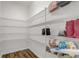 Pantry features abundant white wire shelving and wood-look tile flooring at 3067 Princewood Dr, Minneola, FL 34715