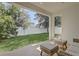 A covered patio overlooking the manicured backyard at 3067 Princewood Dr, Minneola, FL 34715