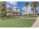 Charming pool house surrounded by manicured landscaping and tropical palm trees at 3067 Princewood Dr, Minneola, FL 34715