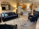 Bright and airy living room featuring stylish furnishings and a seamless transition to the modern kitchen at 310 Knoll Pl, The Villages, FL 32162