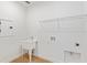 The laundry room features a utility sink, plus washer and dryer hookups at 8323 Sw 58 Loop, Ocala, FL 34481