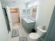 Bright bathroom with a vanity with marble countertop, soft-close drawers, and tiled floor at 12844 Oulton Cir, Orlando, FL 32832