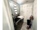 Small Laundry Room with washer, dryer, overhead cabinet, and lighting at 12844 Oulton Cir, Orlando, FL 32832