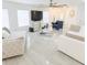 Bright living room with neutral furniture, large TV, tile floors, and lots of natural light at 12844 Oulton Cir, Orlando, FL 32832