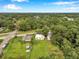 Aerial view of neighborhood with wooded landscape and homes at 1740 Inman Nw Dr, Winter Haven, FL 33881