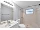 Bathroom includes a shower and vanity with a mirror at 1740 Inman Nw Dr, Winter Haven, FL 33881