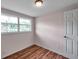 Bedroom featuring natural light and wood-look flooring at 1740 Inman Nw Dr, Winter Haven, FL 33881