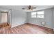 Bedroom with wood floors, natural light, and neutral paint at 1740 Inman Nw Dr, Winter Haven, FL 33881