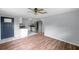 Open-concept living room featuring wood floors and a modern kitchen at 1740 Inman Nw Dr, Winter Haven, FL 33881