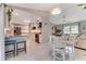 Inviting, open-concept kitchen leading to a comfortable living room space perfect for relaxing and entertaining guests at 64 Alberta Ave, Ponce Inlet, FL 32127