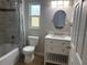 Bright bathroom with a shower-tub combination, a modern vanity, and decorative tile accents at 7144 Remington Oaks Loop, Lakeland, FL 33810