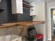 Functional laundry room equipped with custom cabinetry, a built-in sink, and a folding station at 7144 Remington Oaks Loop, Lakeland, FL 33810