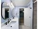 Bathroom boasting double sinks, modern fixtures, and a glass-enclosed shower at 1238 Honeytree E Ln, Lakeland, FL 33801