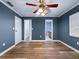 Bedroom with wood-look flooring, complemented by neutral-colored walls and white trim at 1238 Honeytree E Ln, Lakeland, FL 33801